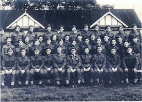Group portrait of a platoon from S Coy, 1 Para, at Bourne, Lincs, in September 1944 prior to Arnhem