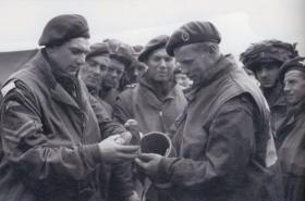 Members of the 6th Airborne Divisional Signals with a pigeon, prior to D-Day, 5 June 1944.