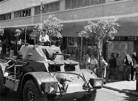 A Staghound of 3 King's Own Hussars on Kingsway during King's Birthday Parade, Haifa, Palestine, 1947