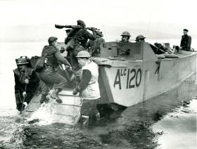 A posed Bruneval training shot of troops on board a landing craft.