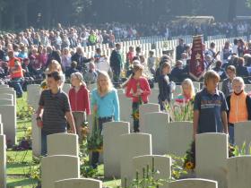 Dutch children place flowers on the graves of British paratroopers.