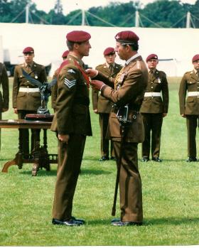 Kevin Waterhouse receiving a medal from Prince Charles