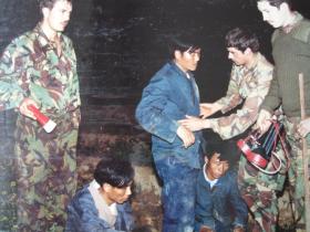 Men of C Coy 1 PARA with illegal immigrants caught at the border with China, Hong Kong, 1980