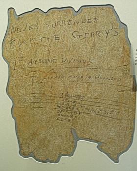 Section of Wallpaper taken from 34, Pieterbergseweg displaying Tony Crane's sniper score and defiant message 