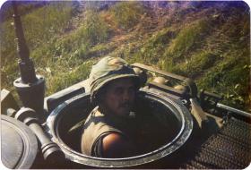Pte Lee Crichton driving an Armoured Personnel Carrier in the US, 1983
