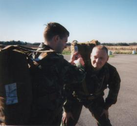 Pte Riley 4 PARA checking my parachute, 1996