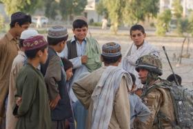 Soldier chats to children in Kandahar City, Afghanistan June 2008