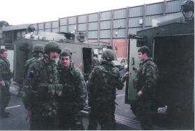 LCpl Dave Arnold and Cpl Moose Millar, 2 PARA, in front of an AT 105 Saxon, Woodbourne RUC Station, July 1993.