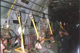Sgt D Curtin, Lcpl Adron Goddard and Lcpl A Gillespie of 144 Parachute Medical Squadron trying out the LLP, c 1990.