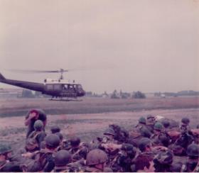 Members of 16 Lincoln Coy waiting for a lift on a Huey for a heli jump, 1970s