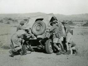 Soldiers from 15th (Kings) Parachute Battalion attempt to recover a crashed Jeep, India, 1946