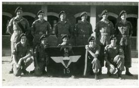 Members of Assault Company, 15th (Kings) Parachute Battalion with the Battalion flag, India, 1946