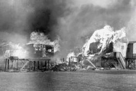 Beach houses on fire, date unknown.