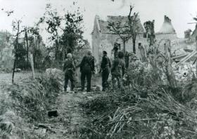 Members of 6th Airborne Division outside Breville church.