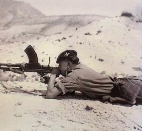 Pte Charlesworth on range practice with a Bren Gun in Cyprus, 1956.