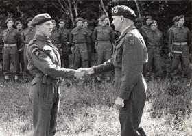 CSM Miller receiving his MM from General Montgomery, 1944.