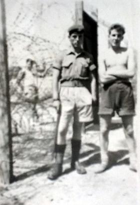Pte Charlesworth and friend outside camp, Cyprus, summer 1956.