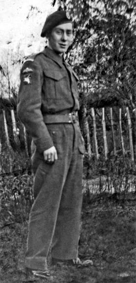 Private Derek Hazell at home wearing his Kings Royal Rifle Corps (KRRC) cap badge, c1942.