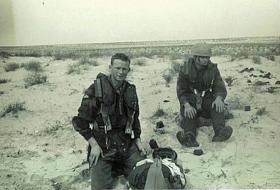 Members of 7 Para Lt Regt RHA on a Drop Zone after a jump, Trucial Oman c 1963.