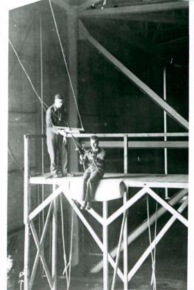 Recruit preparing to jump from a swing-style flight trainer at Ringway in 1943.