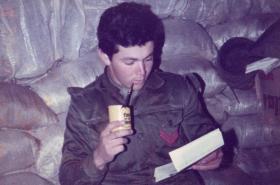 A young Argentine soldier with a letter from home, Falklands, 1982.