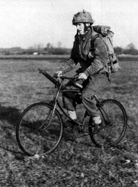 An airborne soldier on a folding bicycle, c1944.