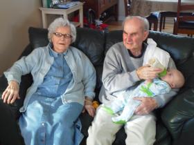 Bruneval veteran Thomas Laughland with his wife Margaret and their twelfth great grandchild, 2012.