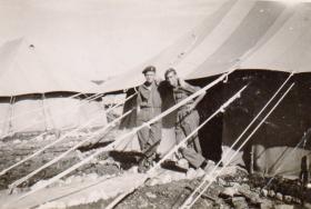 Gunner Hare outside tent with a friend