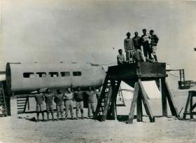 Indian airborne troops are talked through ground training apparatus.