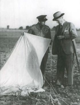 The Viceroy of India Lord Linlithgow inspects parachute with Sqn Ldr Brereton at New Delhi, 1941.