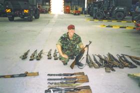 Jason Connolly with a weapons haul from Op Harvest at Mkronic Grad Bus Deport, Bosnia