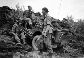 OS Members of 158 Parachute Field Regiment RA, resting with Airborne Jeep, India, Post War, date unknown.