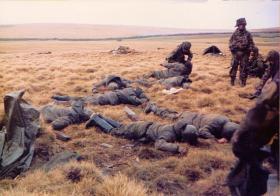 Members of D Coy, 2 PARA, with Argentine prisoners at the Battle for Goose Green, near Boca House, 28 May 1982.