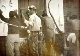 Pte L Wright guarding some EOKA suspects, Cyprus 1955.