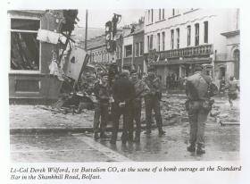 Lt Col Wilford, 1 PARA CO, assesses bomb damage on the Shankhill Road, Belfast, 1972