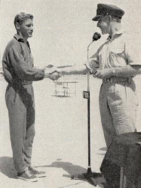 Cpl Macefield receives his prize from Maj Gen Darlng, 1960. 