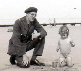 Major Townsley, 181st Airlanding Field Ambulance RAMC, with his daughter on leave in the UK. date unknown. 