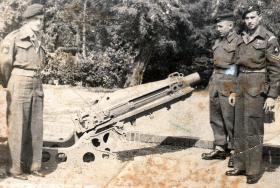 Sgt Malone, second right, with a 75mm Pack Howitzer.