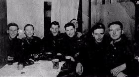 Members of 8th Battalion relaxing with a pint.