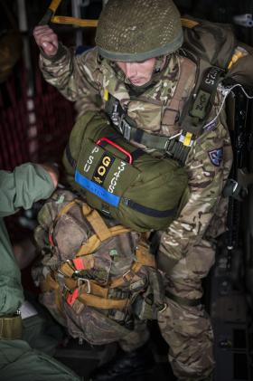 A Paratrooper is checked by a Parachute Jump Instructor on Exercise Capable Eagle, 22 October 2013.
