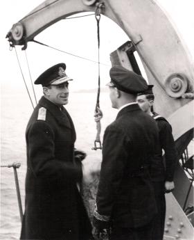 Lord Mountbatten talks with Commander HB Peate, HMS Prins Albert, after the operation, Bruneval, 1942.