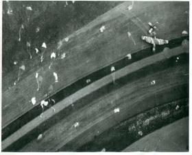 Many parachutes and a a Horsa glider landing north-east of Caen.