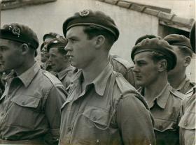 Men of 1st Airborne Division listen intently to General Eisenhower, c1942/3.