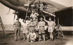 Sgt Dick Southwood and members of 113 Sqn in front of a C47 under repair, RAF Aqir, Palestine, 1946
