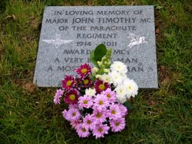 Images of the memorial stone for Maj John Timothy MC, Timberscombe, 2012.