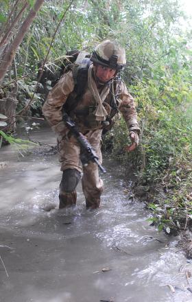 2 PARA soldier patrolling through an irrigation ditch, Afghanistan, July 2008