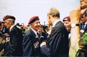 HRH Prince Charles speaks to Paul Aller at the 60th Aniversary of D-Day, 2004