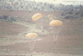 A member of 10 PARA landing on Hankley Common with reserve deployed, ABF Day 1985.