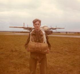 Pte Mobsby next to an Argosy before a commemorative jump into Arnhem, 1970