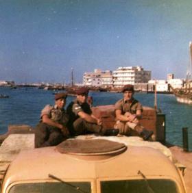 Dvr John Silcock, Cpl Brian Jones and Dvr Tom Cassidy on a Bedford Water Carrier, Bahrain, c1964.